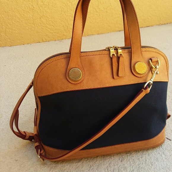 navy and tan handbag